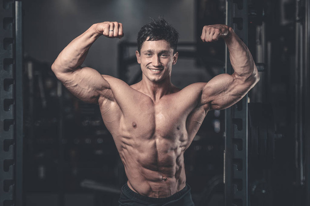 Handsome power athletic man on diet training pumping up muscles - Фото, зображення