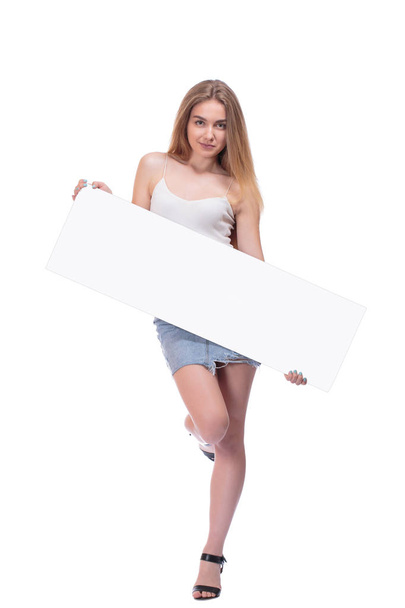 blond girl posing with big nameplate isolated on white background - Zdjęcie, obraz