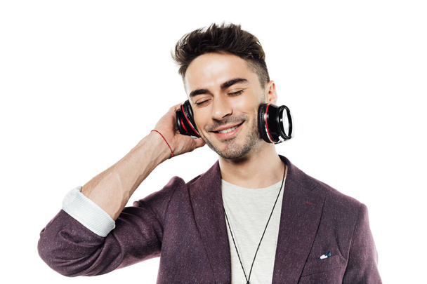 Young man in headphones  - Фото, изображение