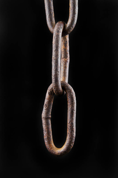 chain isolated on black background closeup - Фото, изображение