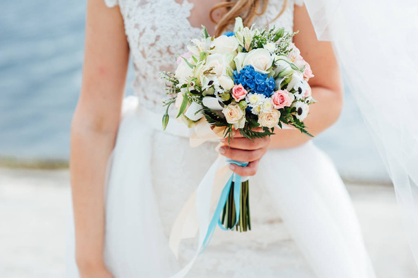 beautiful bouquet in hands of the bride - Фото, изображение