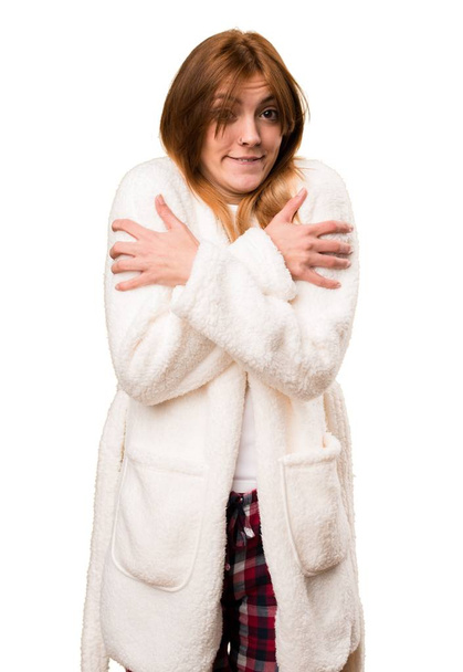 Young woman in dressing gown freezing - Foto, Imagen