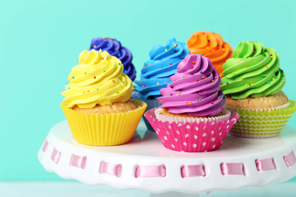 Tasty cupcakes on cake stand - Фото, изображение