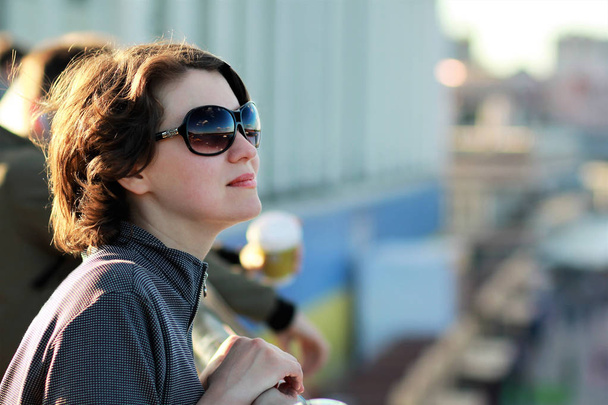 Portrait of a young woman wearing sun glasses  - Photo, Image