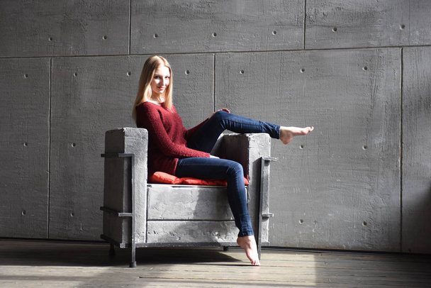 Beautiful blonde posing in a chair - Photo, Image