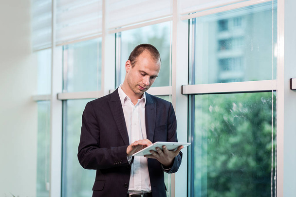 Close up image of business man holding a digital tablet,Portrait - Photo, Image