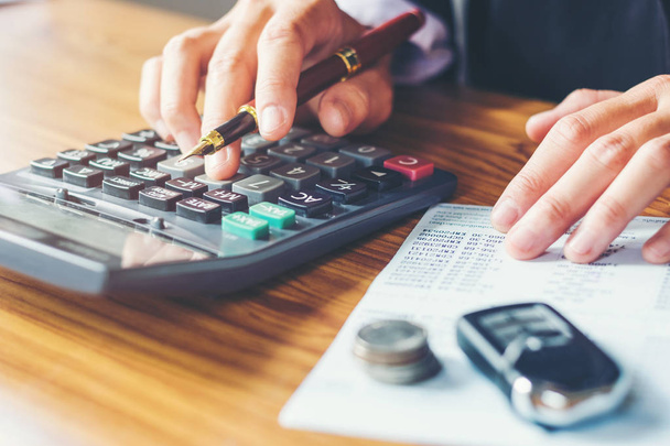 Businessman's hands with calculator and cost at the office and F - Fotoğraf, Görsel