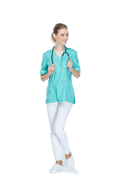 Молодая улыбающаяся медсестра со стетоскопом
 - Фото, изображение