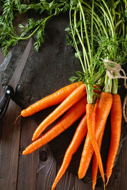 Heap of ripe carrots. - Фото, изображение