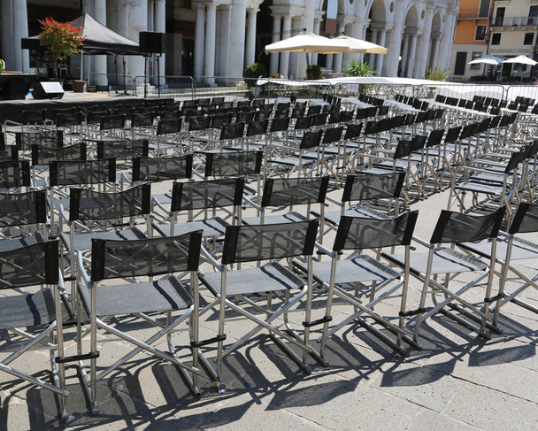 many black chairs without people in the main square in vicenza c - Photo, Image