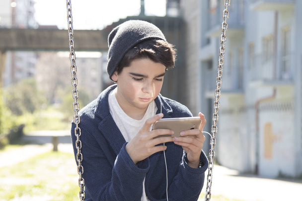 child with cellphone - Photo, Image
