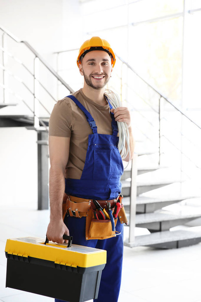 electrician holding bunch of wires and toolbox - Foto, Imagem