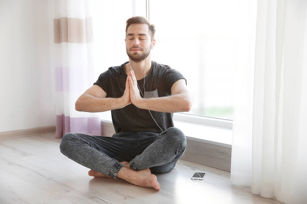 man practicing yoga  - Фото, зображення