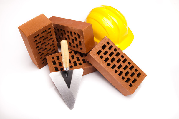Brick, yellow hard hat, tools - Photo, Image