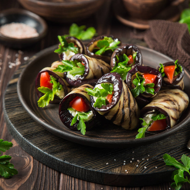 eggplant rolls with garlic feta, tomatoes and herbs - Photo, Image
