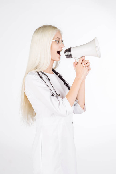 Female doctor with stethoscope and megaphone.  - Photo, image