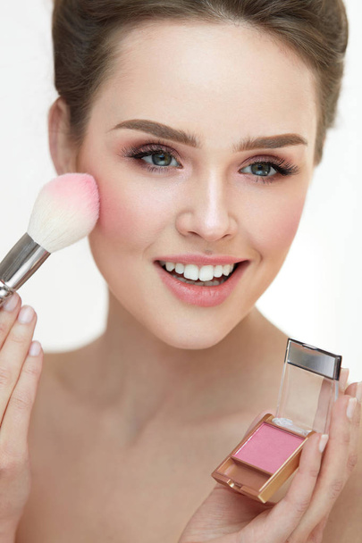 Beauty Cosmetics. Hands Applying Blush On Woman's Facial Skin - Фото, изображение