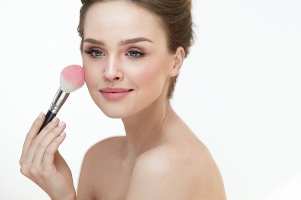 Woman Face Beauty. Sexy Girl Putting Blush With Facial Brush  - Fotografie, Obrázek