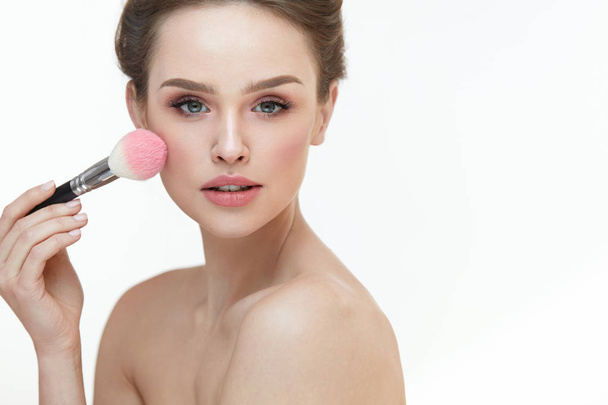 Woman Face Beauty. Sexy Girl Putting Blush With Facial Brush  - Zdjęcie, obraz