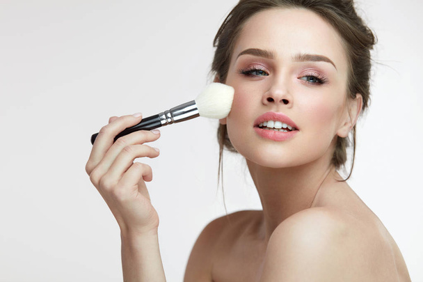 Facial Makeup. Beautiful Female Applying Blush With Brush - Φωτογραφία, εικόνα