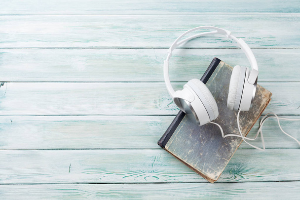 Headphones and old book  - Zdjęcie, obraz