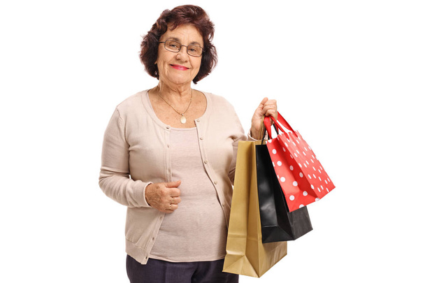 Elderly woman with shopping bags - Fotografie, Obrázek