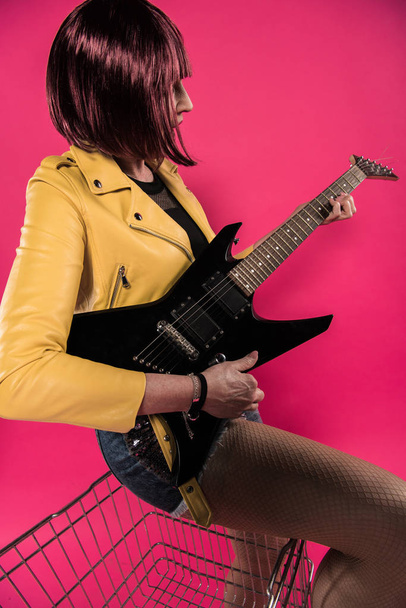 Senior woman with electric guitar  - Fotoğraf, Görsel