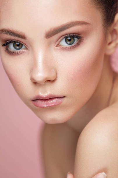 Facial Beauty Makeup. Woman With Fresh Face On Pink Background - Valokuva, kuva