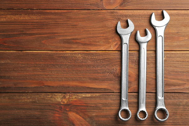 Combination wrenches on wooden background - Фото, зображення