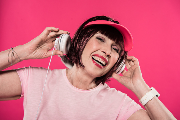 woman listening music in headphones - Foto, Bild