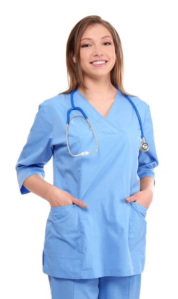Beautiful young female doctor on white background - Zdjęcie, obraz
