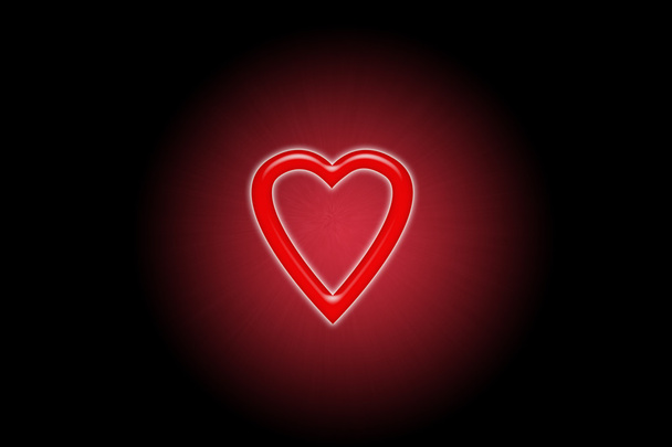 Red heart glowing in the dark in blurred circle - Photo, Image