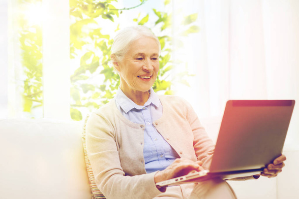 happy senior woman with laptop at home - Photo, image