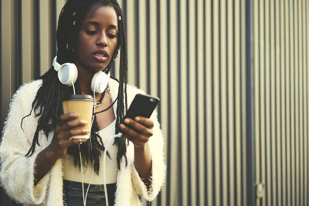 Attractive hipster girl listening music  - Zdjęcie, obraz