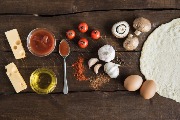 ingredients for preparing pizza on wooden tabletop - Photo, Image