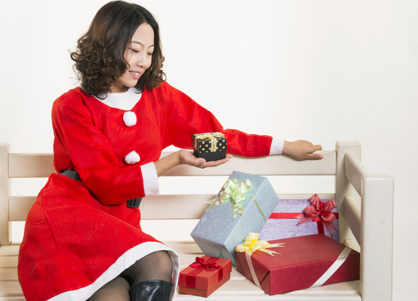 Christmas girl and gift - 写真・画像