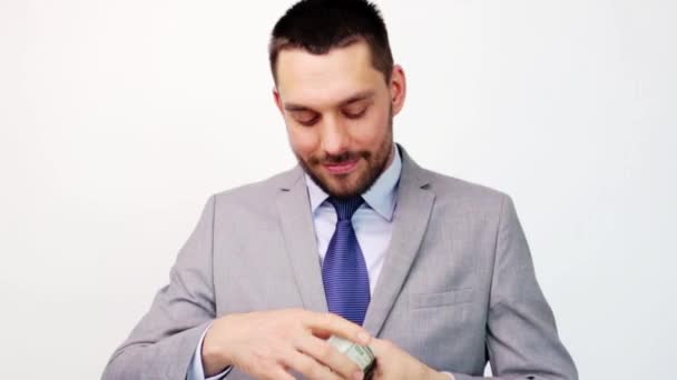 happy businessman with packet of dollar money - Video, Çekim