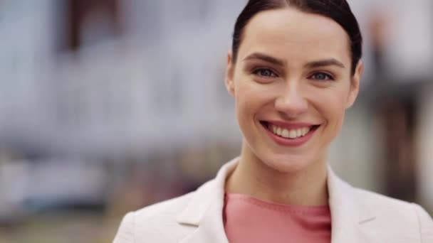 close up of happy smiling young woman outdoors - Záběry, video