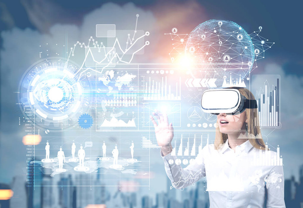 Blond woman in vr glasses in city, graphs - Photo, Image