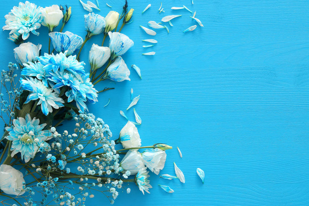 delicate blue flowers arrangement on wooden background. Copy space - Photo, Image