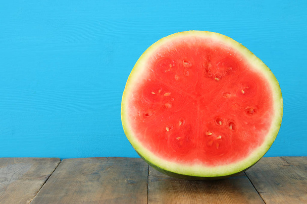 fresh sliced watermelon over wooden table - 写真・画像