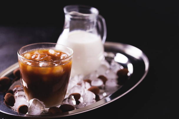 Iced coffee with milk and chocolate truffles in glasses - Foto, Imagem