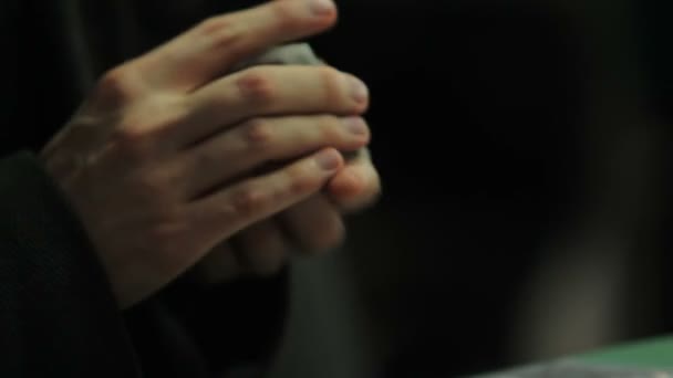 Male hands thoroughly shuffling cards, going to play game of chance, gambling - Materiał filmowy, wideo