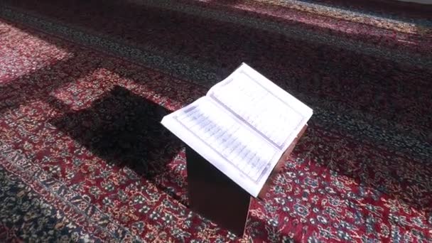 Open the Koran in the Mosque on the Table. Are visible Ayyats. - Footage, Video