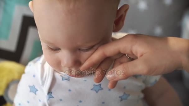 Woman strokes little boys face - Felvétel, videó