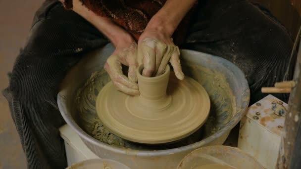 Professional male potter making mug in pottery workshop - Footage, Video