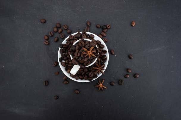 Coffee mug full of beans - Фото, изображение
