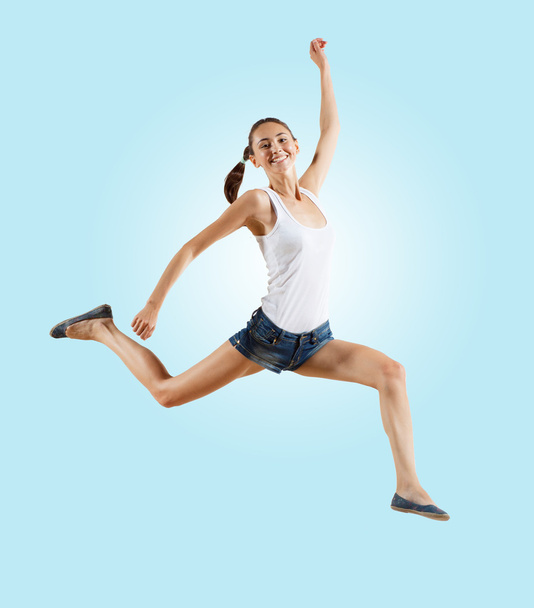 Modern style female dancer jumping and posing - Photo, Image