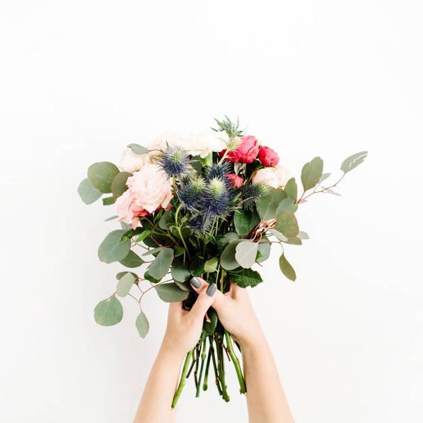 Girl's hands holding beautiful flowers bouquet - Фото, зображення