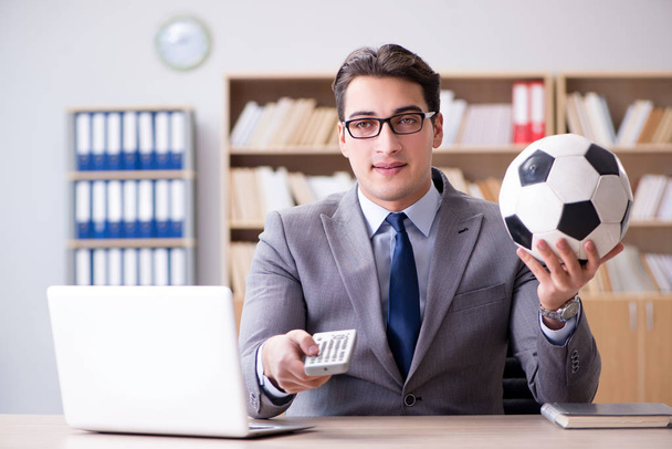 Businessman with football ball in office - Zdjęcie, obraz